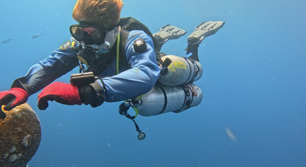 Malachi Jack working underwater in technical scuba equipment