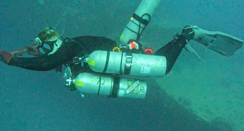 Malachi Jack underwater in a technical scuba configuration
